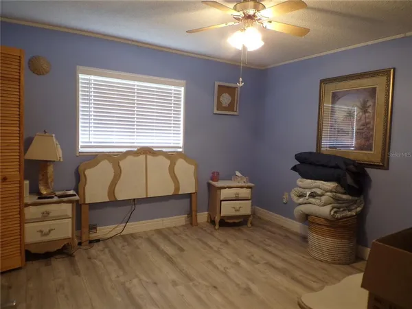 a bedroom with furniture and a window