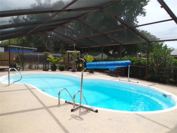 a view of a swimming pool with a patio