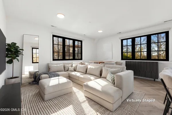 a living room with furniture and a window