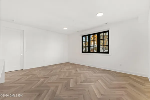 a view of an empty room with a window