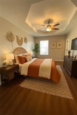 a bedroom with a large bed and a chandelier