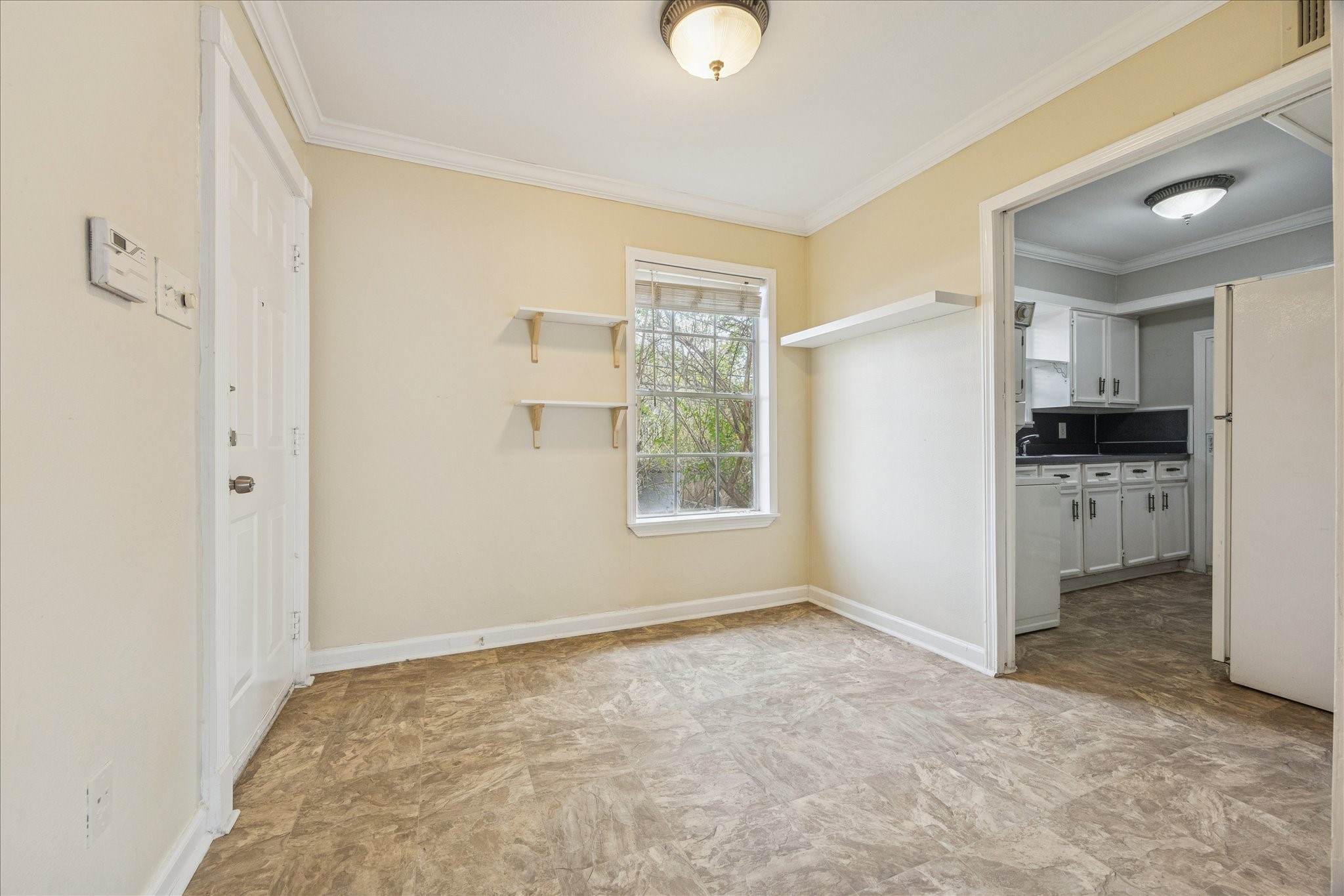 218 West 15th Street, Unit D Houston, TX 77008 - Photo 3 of 10 a view of empty room with kitchen and window