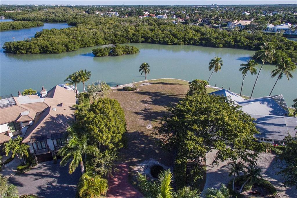 5 Sabre Lane Naples, FL 34102 - Photo 5 of 6 an aerial view of lake and residential houses with outdoor space