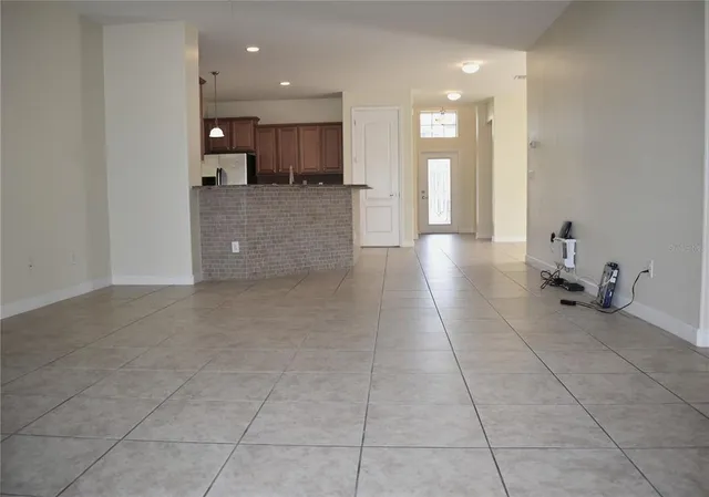 a view of a kitchen with a sink and cabinets