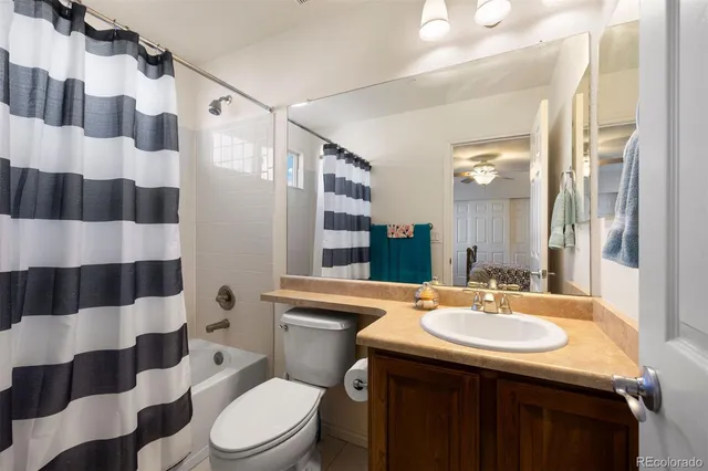 a dining room with furniture and a flat screen tv