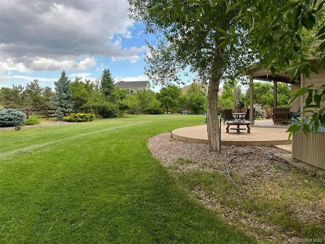 a view of a house with swimming pool and sitting area