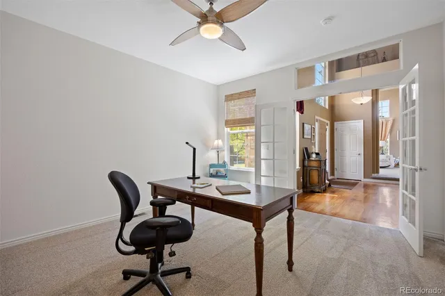 a view of a livingroom with furniture and a window