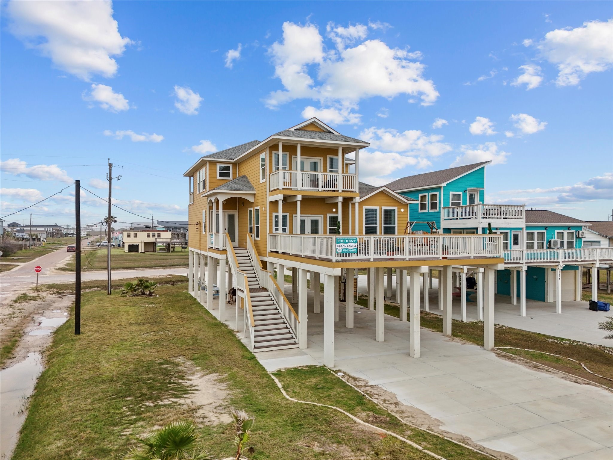 1018 Seashell Drive Surfside Beach, TX 77541 - Photo 1 of 49 This elevated home features a bright, inviting exterior with ample deck space, offering stunning views and coastal living. Ideal for relaxation and entertaining.