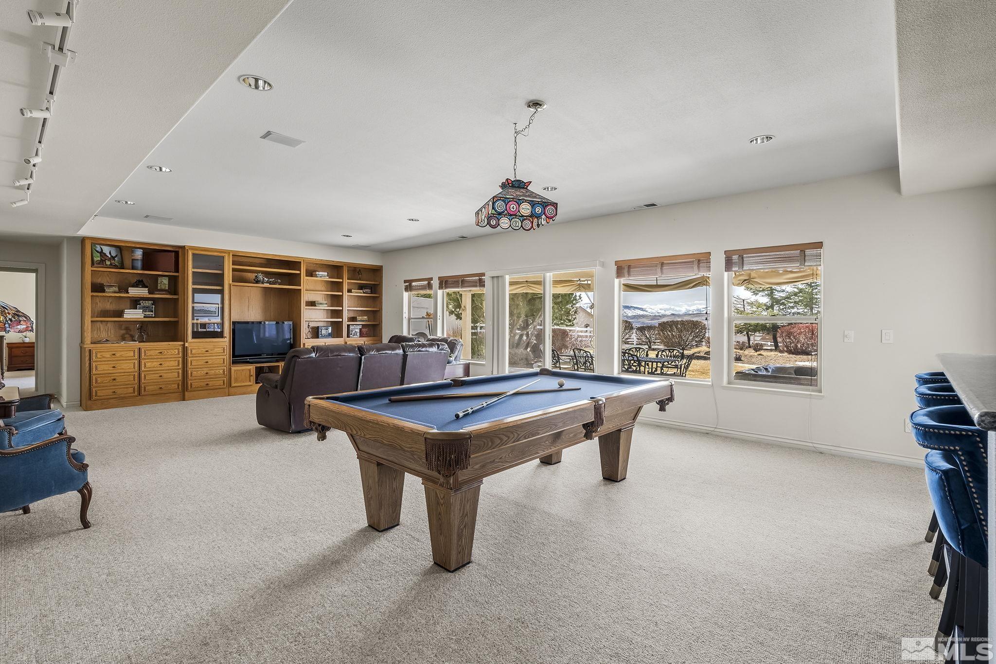 8755 Eaglenest Road Sparks, NV 89436 - Photo 11 of 40 a room with furniture and gym equipment