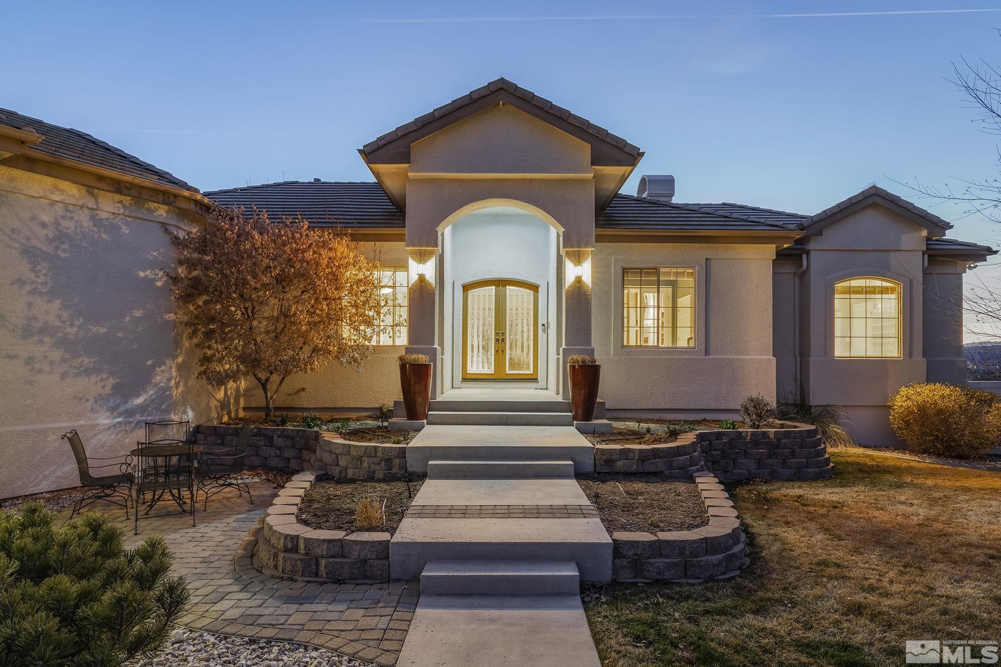 8755 Eaglenest Road Sparks, NV 89436 - Photo 17 of 40 a front view of a house with a yard