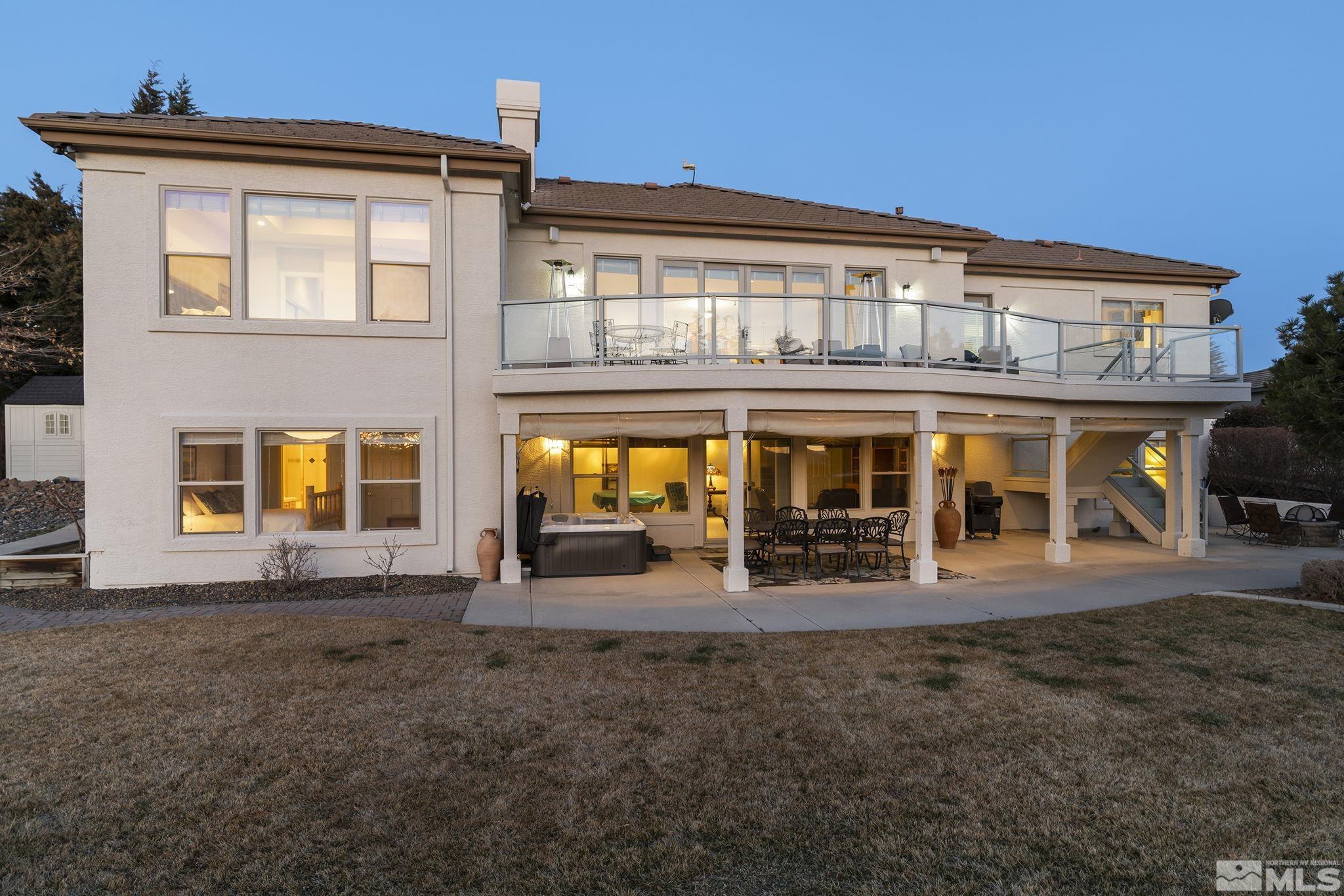 8755 Eaglenest Road Sparks, NV 89436 - Photo 18 of 40 front view of a building with a yard