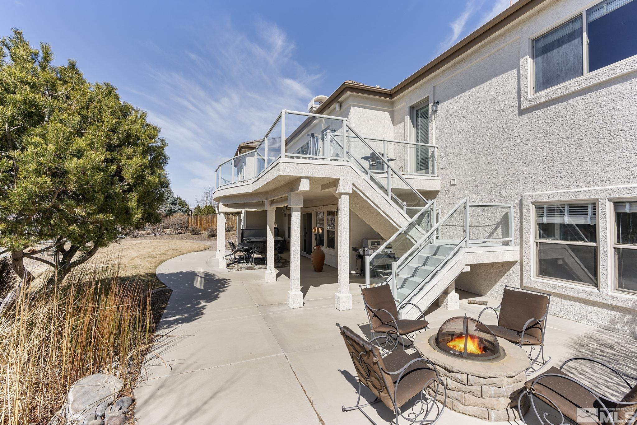 8755 Eaglenest Road Sparks, NV 89436 - Photo 19 of 40 a view of a house with pool and sitting area