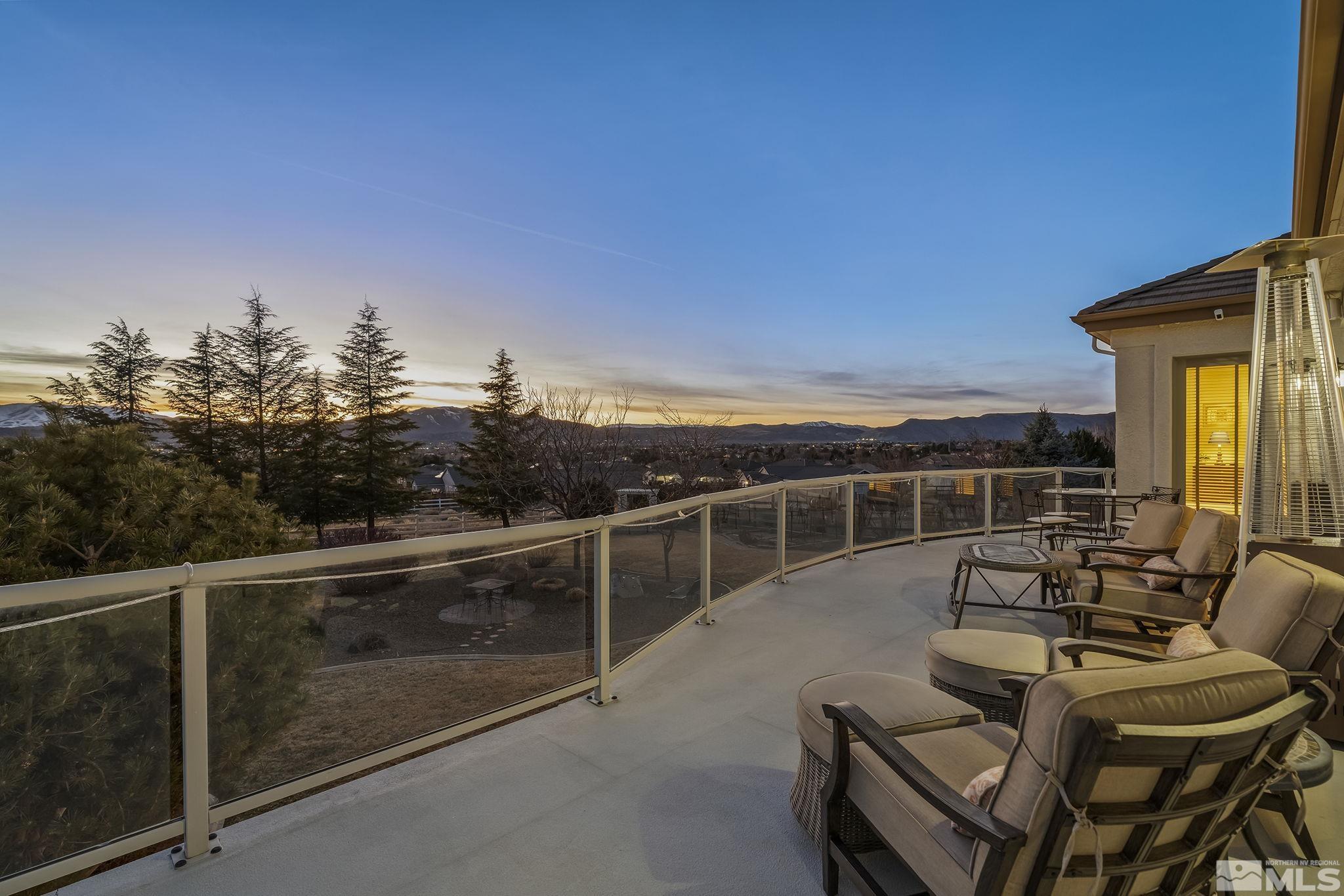 8755 Eaglenest Road Sparks, NV 89436 - Photo 2 of 40 a view of a balcony with furniture and city