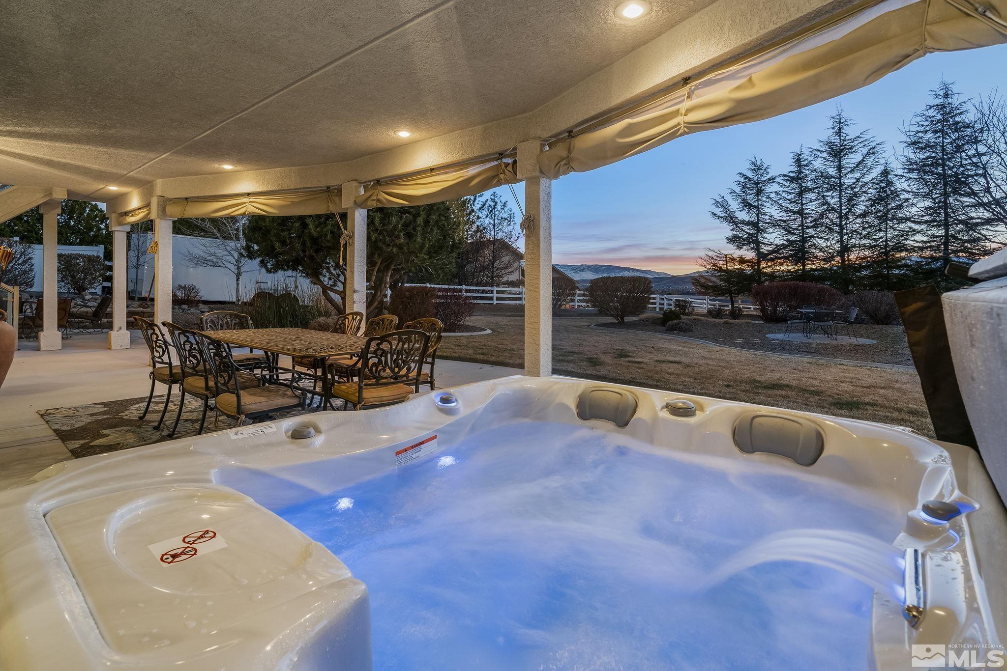 8755 Eaglenest Road Sparks, NV 89436 - Photo 23 of 40 a swimming pool with outdoor seating and yard