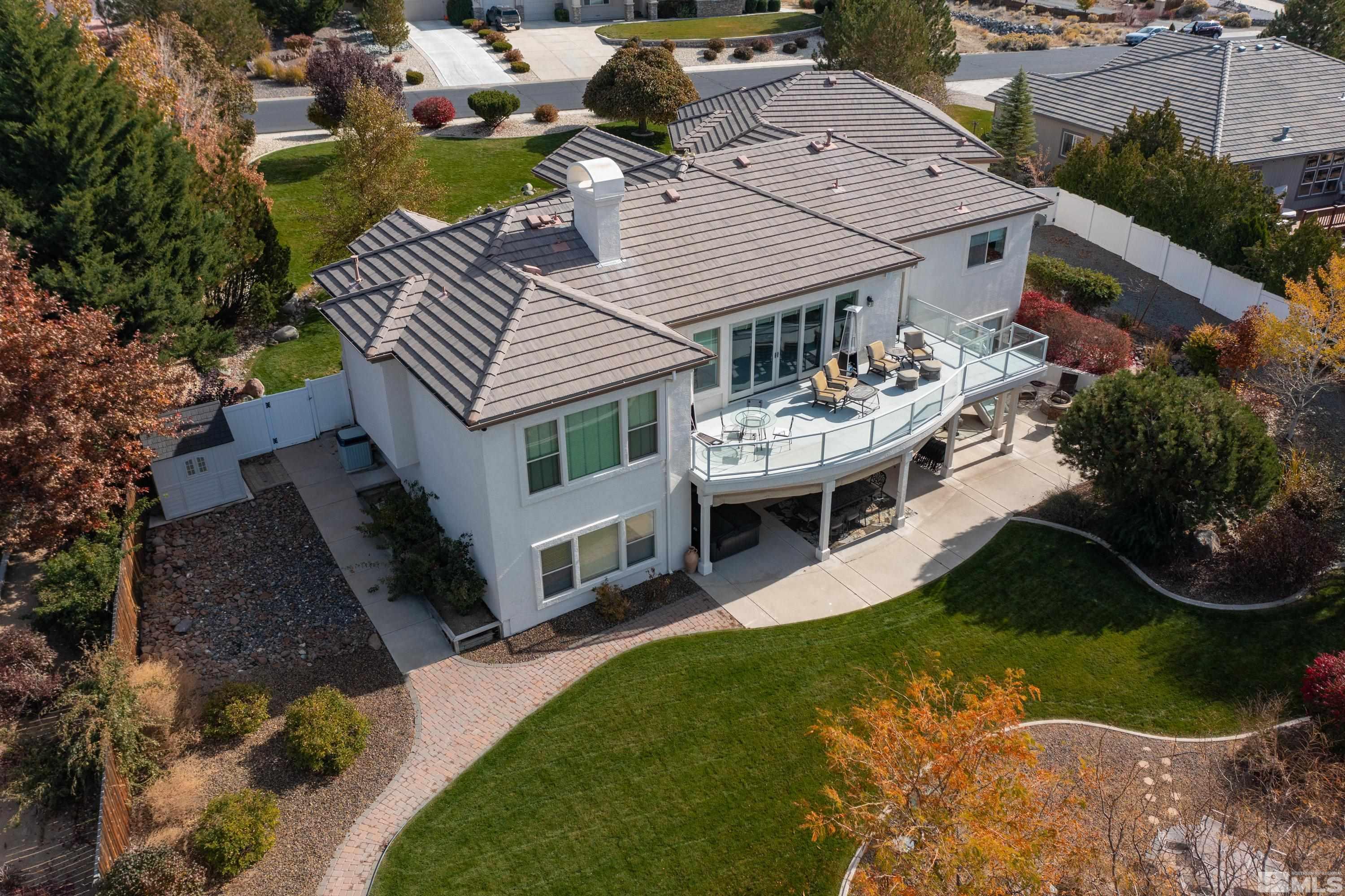 8755 Eaglenest Road Sparks, NV 89436 - Photo 25 of 40 a view of a house with backyard and sitting area