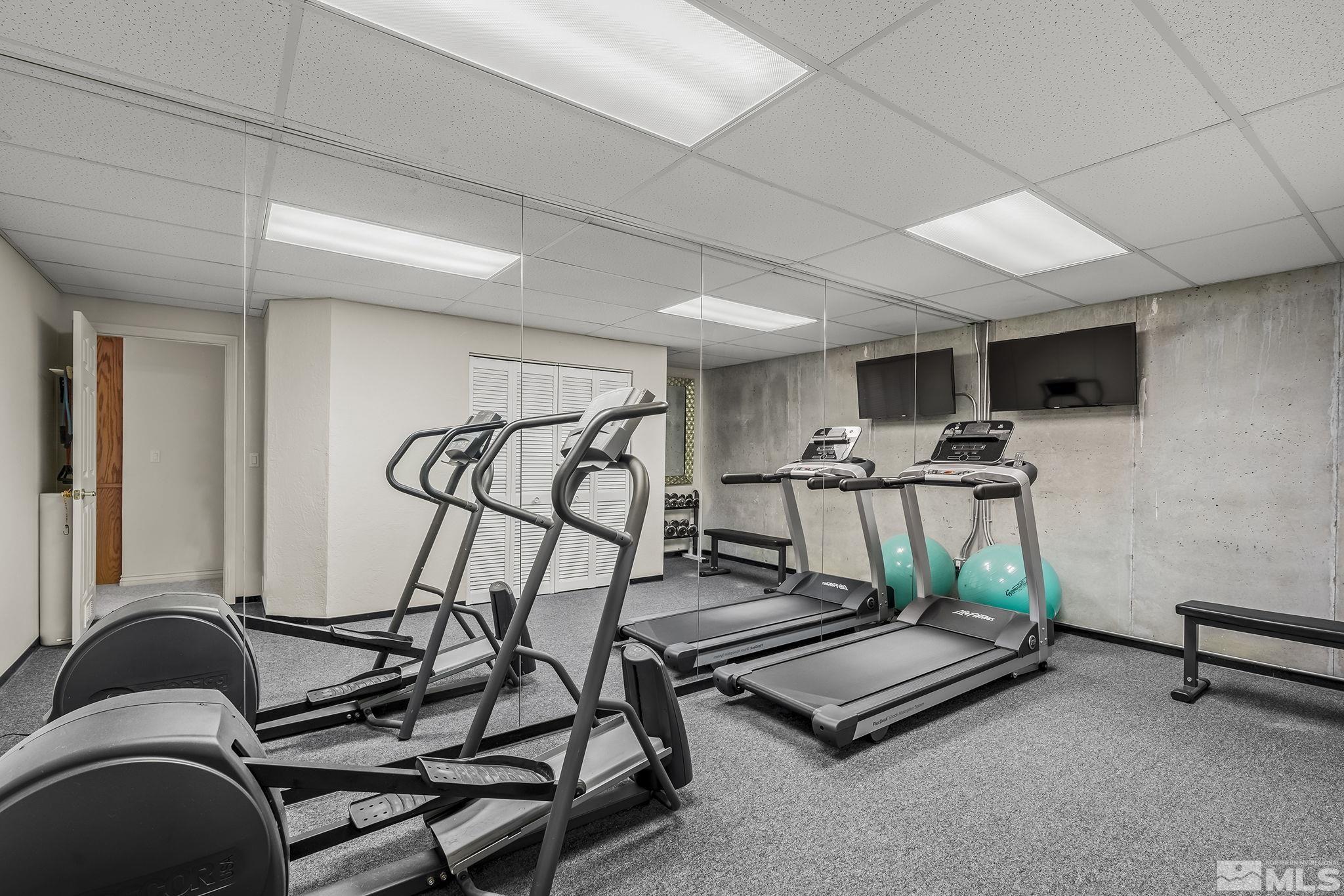 8755 Eaglenest Road Sparks, NV 89436 - Photo 30 of 40 a room with gym equipment and white walls
