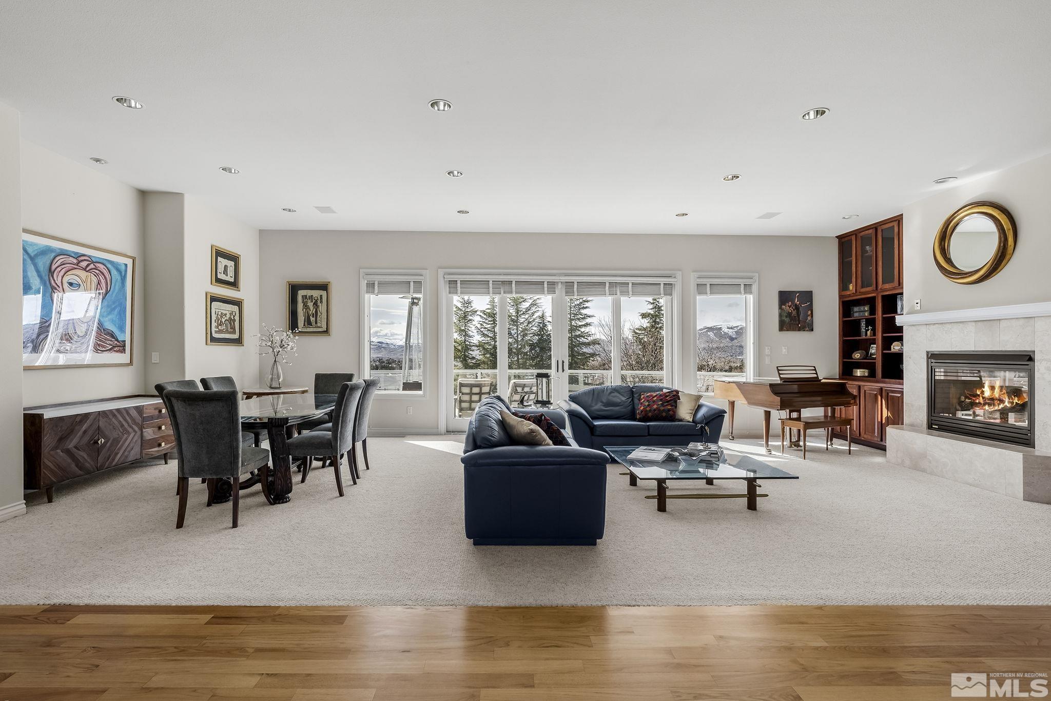 8755 Eaglenest Road Sparks, NV 89436 - Photo 3 of 40 a living room with fireplace furniture and a large window