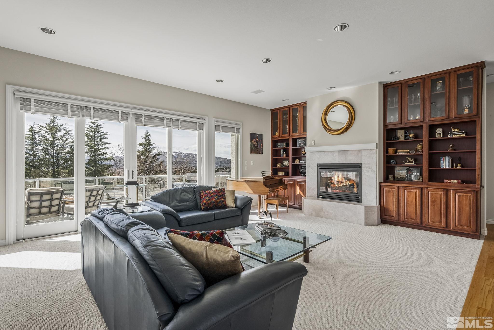 8755 Eaglenest Road Sparks, NV 89436 - Photo 32 of 40 a living room with furniture and a fireplace