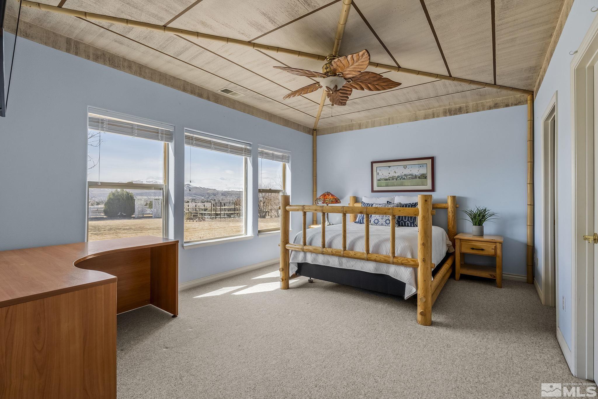 8755 Eaglenest Road Sparks, NV 89436 - Photo 33 of 40 a bed room with a bed and a window