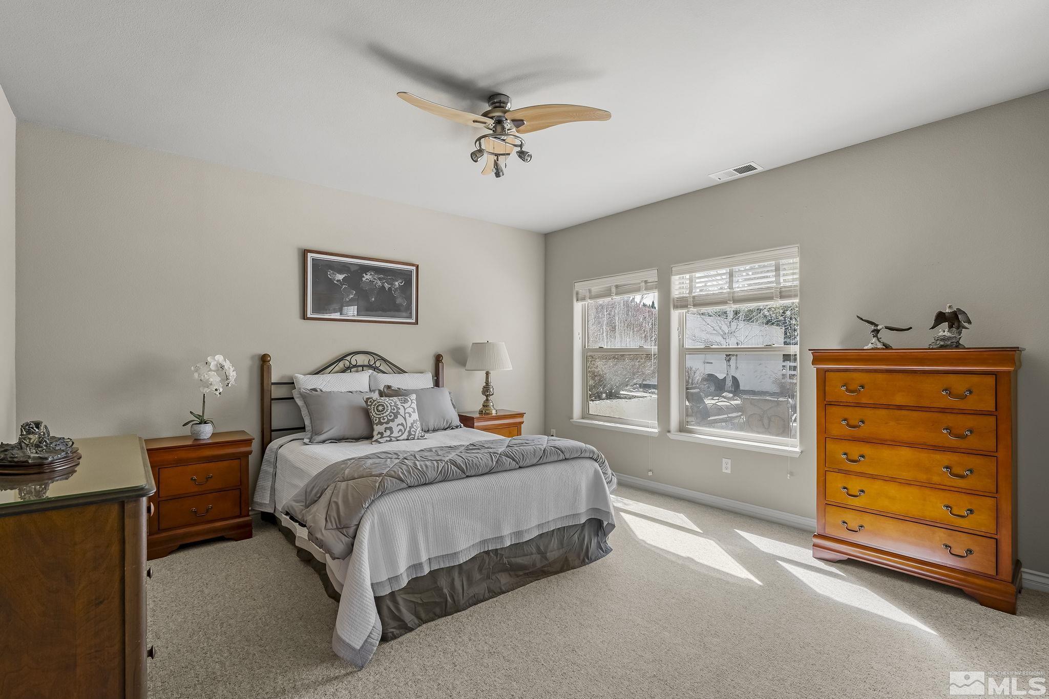 8755 Eaglenest Road Sparks, NV 89436 - Photo 35 of 40 a bedroom with a bed and a window