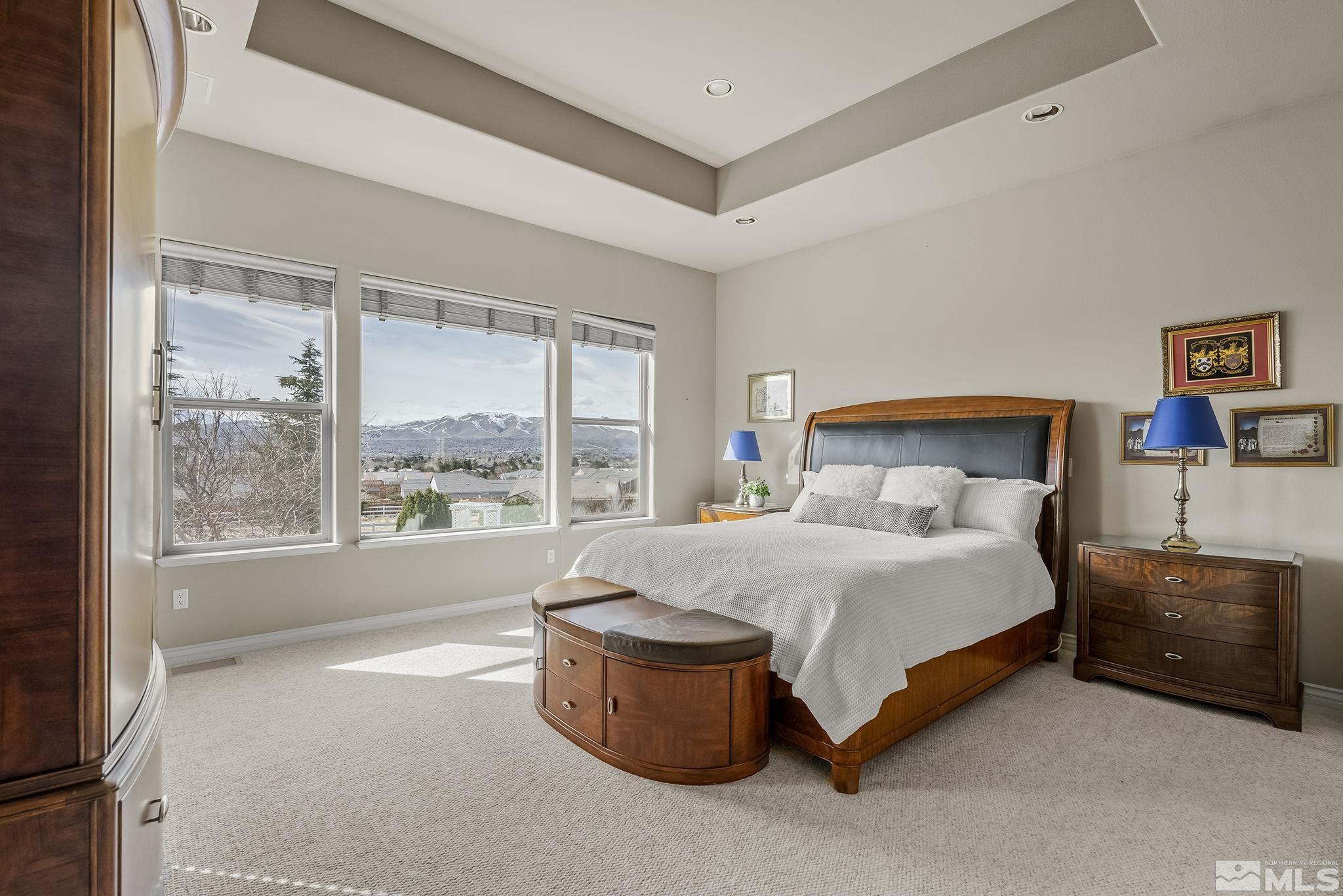 8755 Eaglenest Road Sparks, NV 89436 - Photo 7 of 40 a bedroom with a bed and a large window