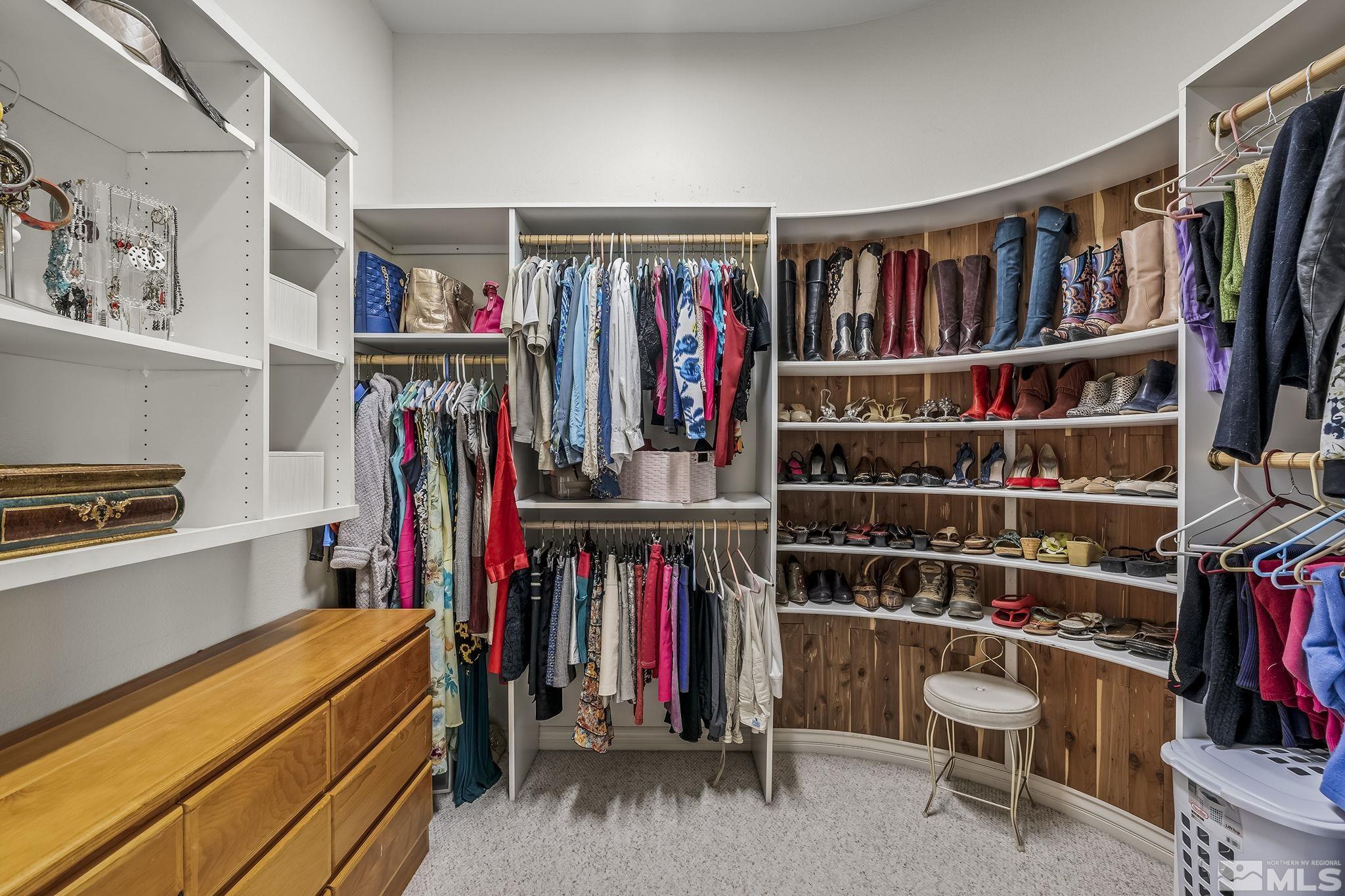 8755 Eaglenest Road Sparks, NV 89436 - Photo 10 of 40 a view of walk in closet with clothes and shoes