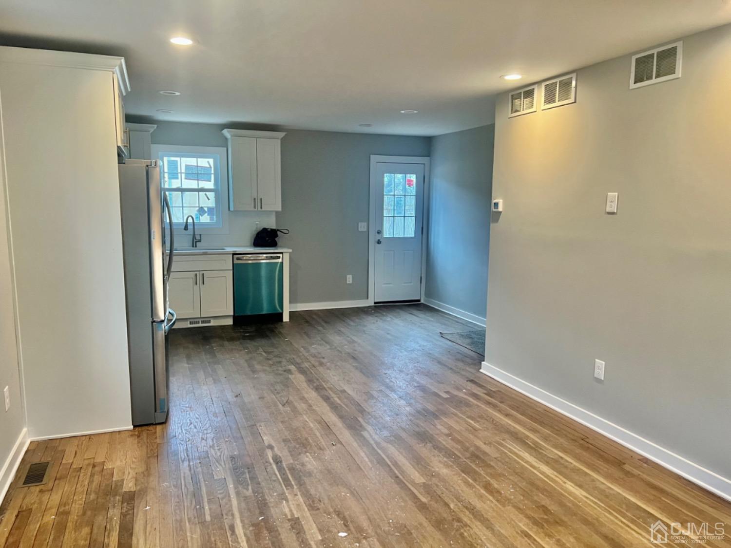405 Crows Mill Road Fords, NJ 08863 - Photo 2 of 20 a view of a kitchen with wooden floor and electronic appliances
