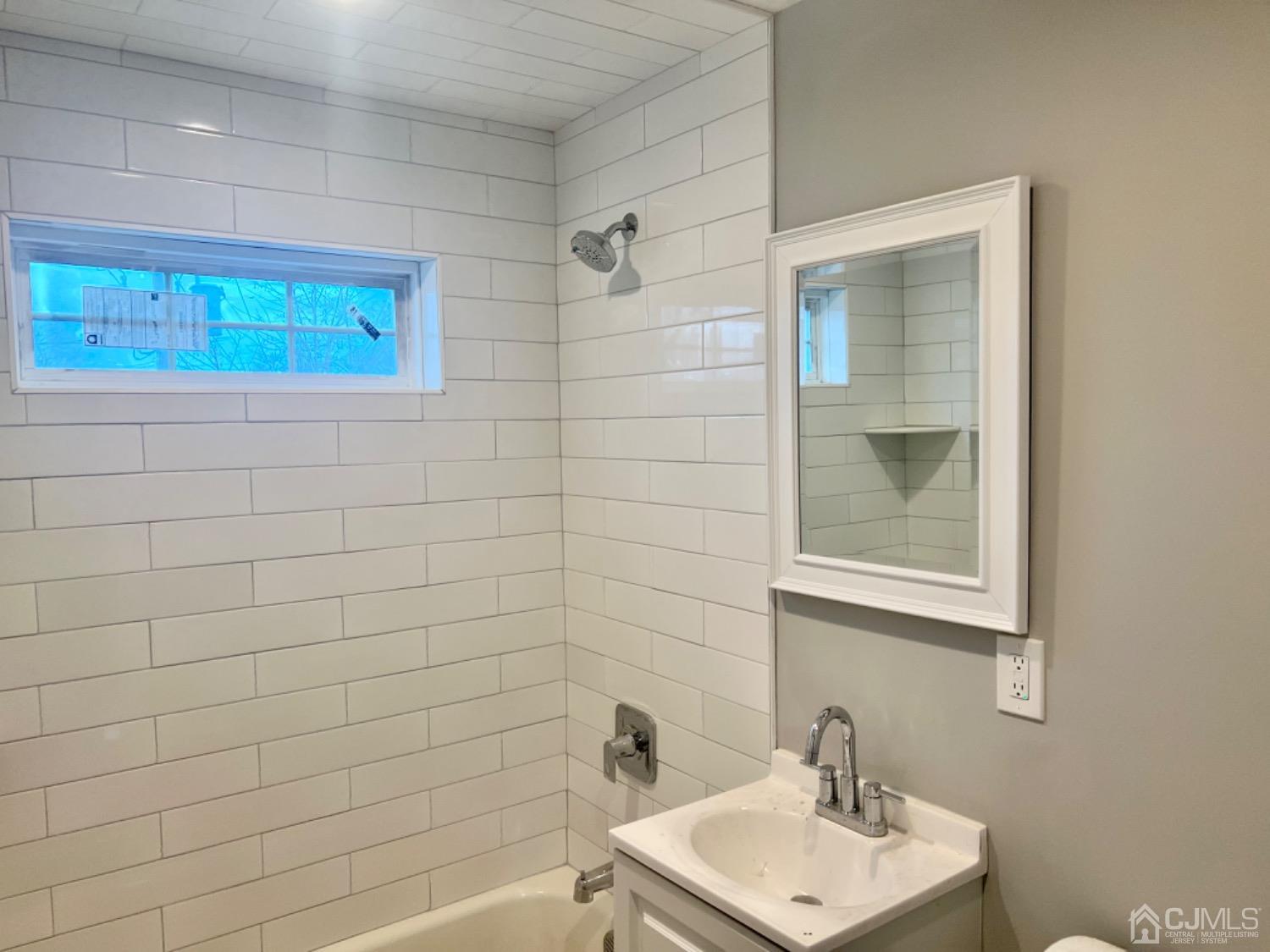 405 Crows Mill Road Fords, NJ 08863 - Photo 8 of 20 a bathroom with a sink a toilet and shower