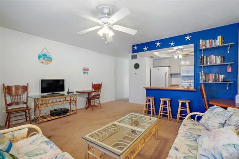 a kitchen that has a lot of cabinets a sink and a stove in it