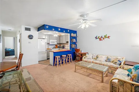 a kitchen with white cabinets sink and white appliances