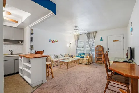a view of livingroom with furniture and windows