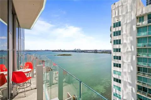 a view of swimming pool from a balcony