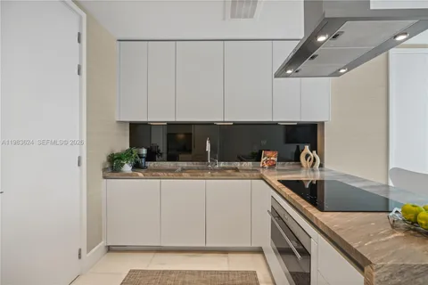 a kitchen with a sink and cabinets