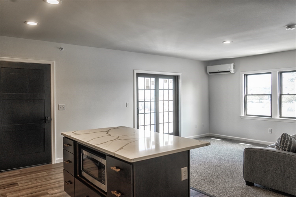 49 Center Street Barnstable, MA 02601 - Photo 16 of 36 a kitchen with a stove and a window