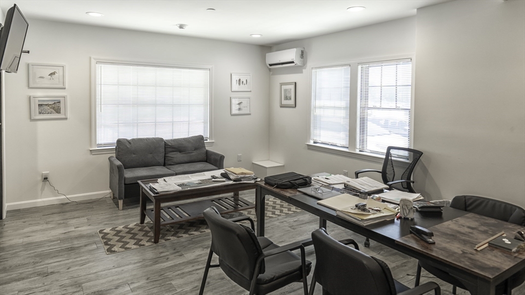 49 Center Street Barnstable, MA 02601 - Photo 25 of 36 a view of a workspace with furniture and a window