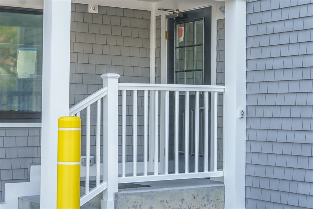49 Center Street Barnstable, MA 02601 - Photo 4 of 36 a view of front door and small yard