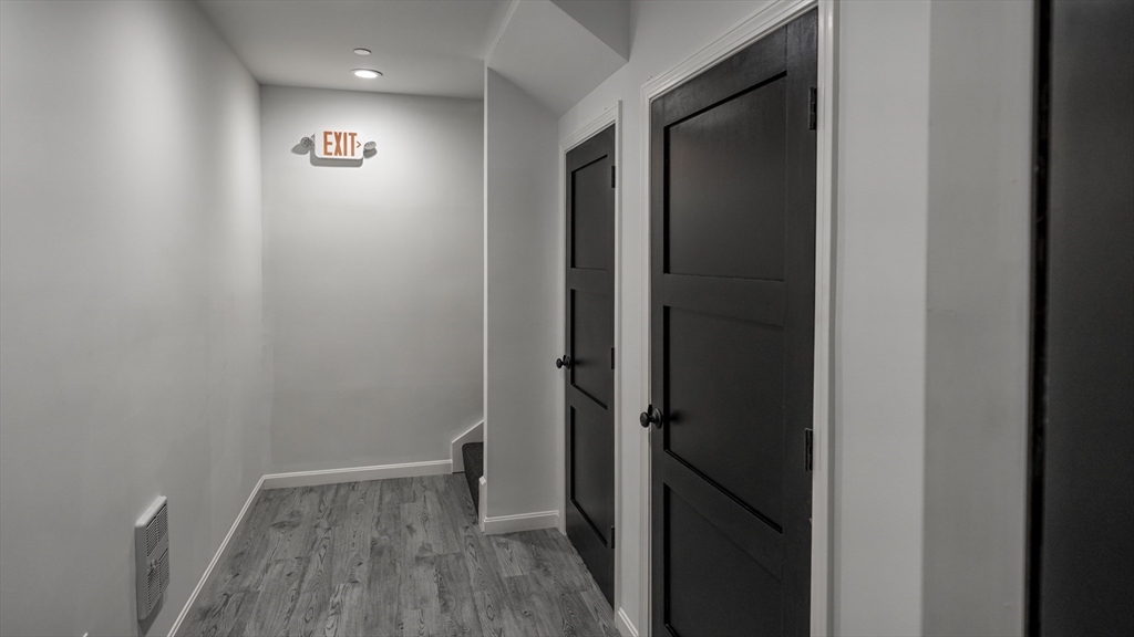 49 Center Street Barnstable, MA 02601 - Photo 7 of 36 a view of a hallway with wooden floor