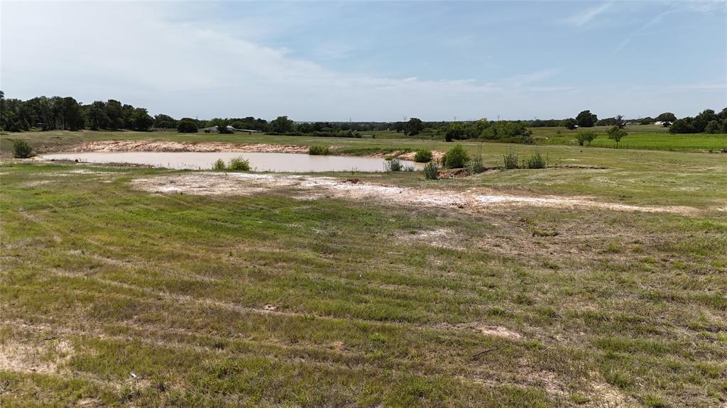 8605 West Highway 199 Springtown, TX 76082 - Photo 19 of 23 Expansive natural landscape featuring a prominent pond