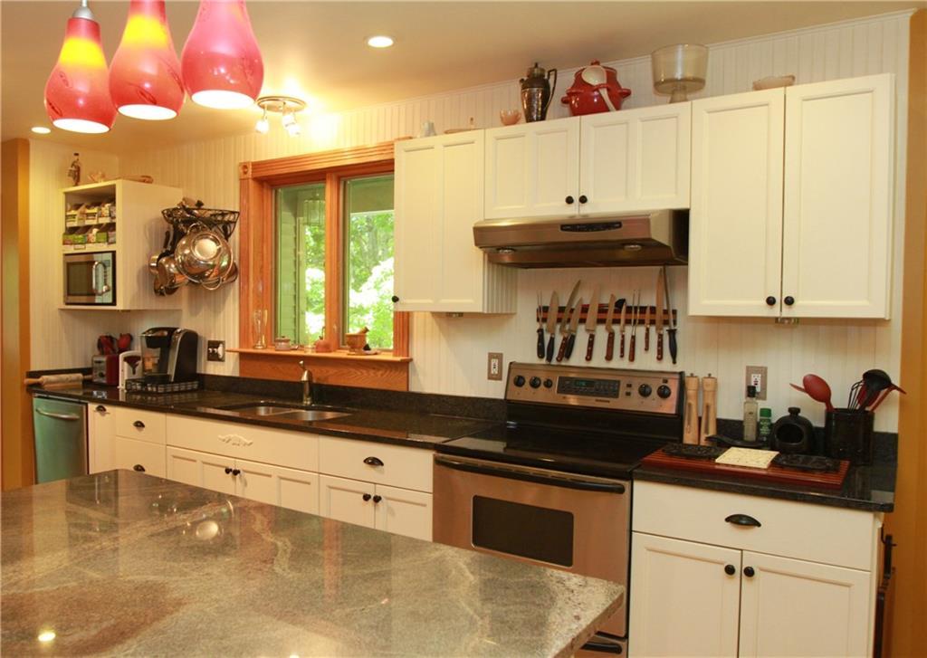 306 Ridge Road Bowdoinham, ME 04008 - Photo 15 of 35 Kitchen island area leads to mudroom