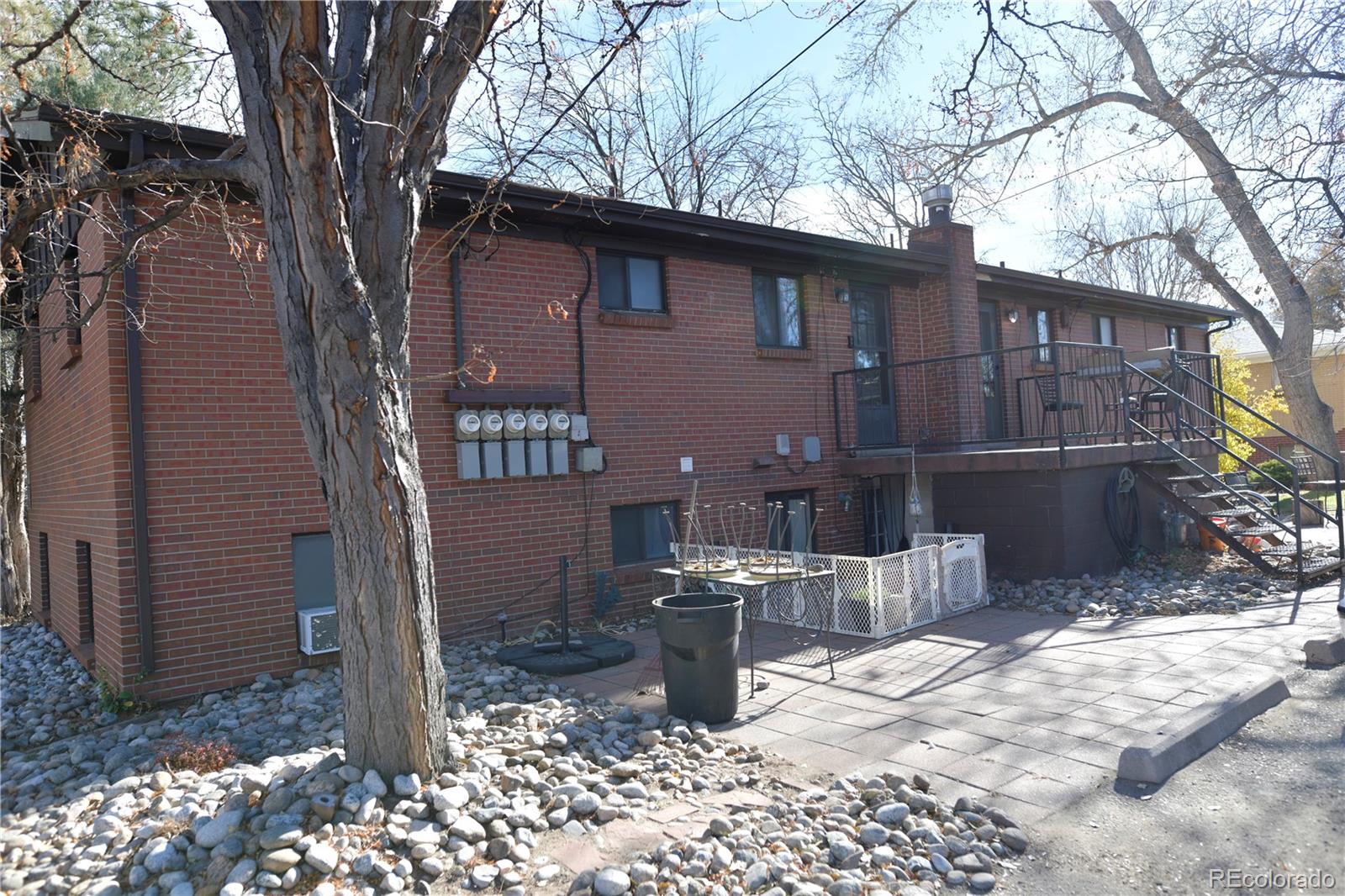 4563 Everett Street Wheat Ridge, CO 80033 - Photo 4 of 10 a backyard of a house with barbeque oven and outdoor seating
