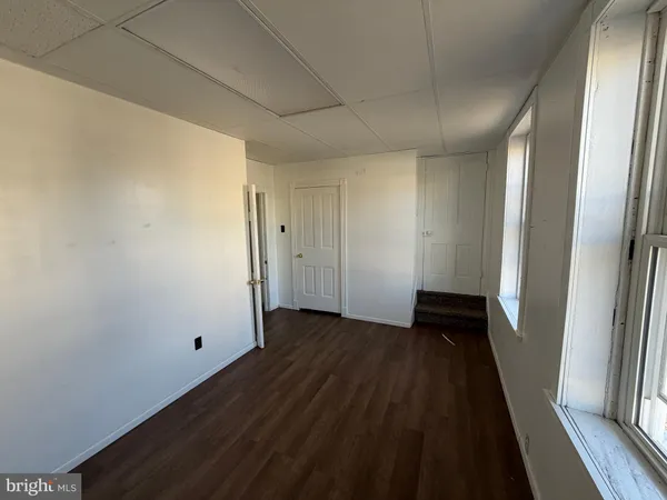 a bathroom with a tub and a window