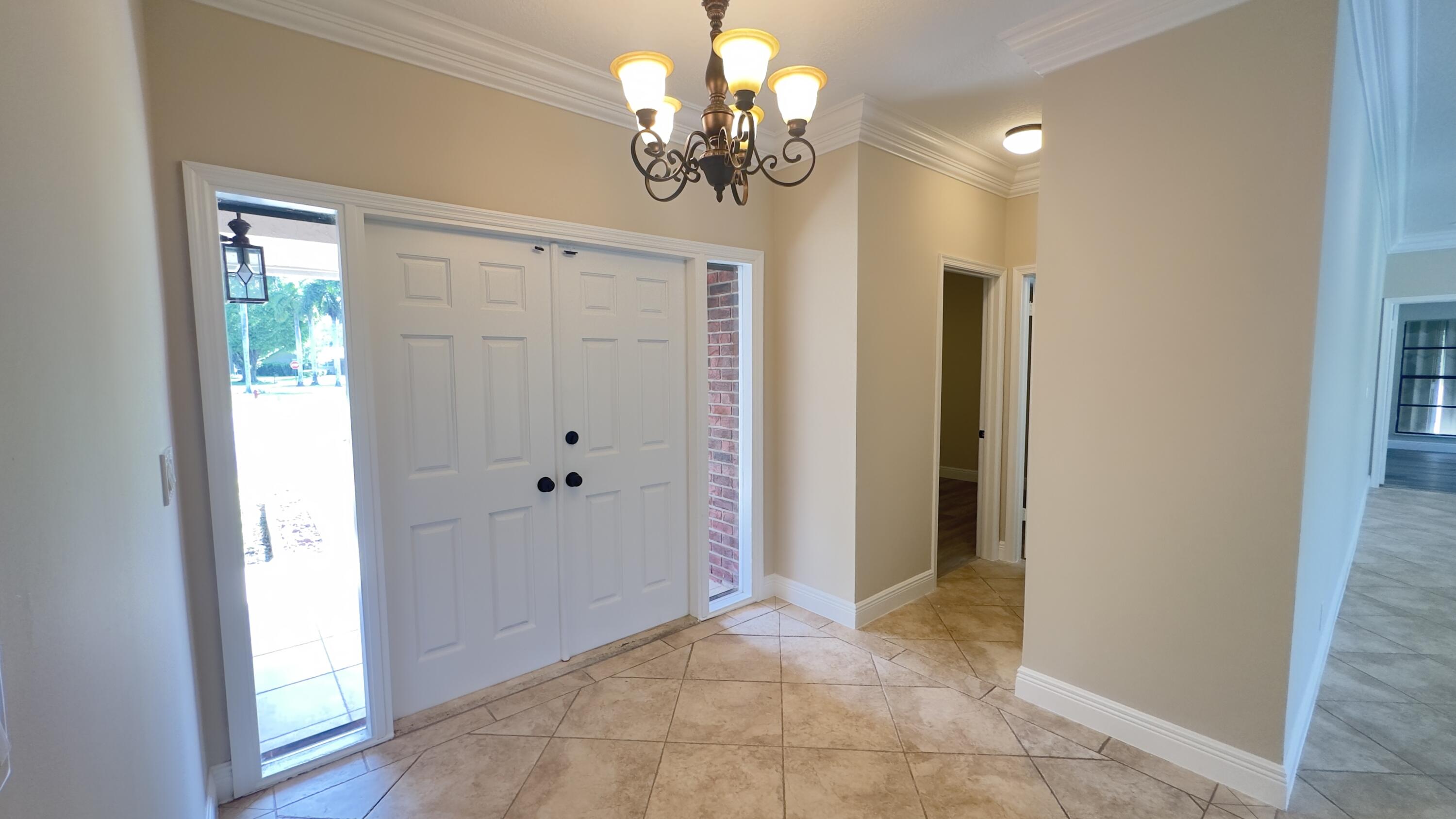 11330 Timber Lodge Terrace Boca Raton, FL 33428 - Photo 2 of 23 a view of a chandelier in a room