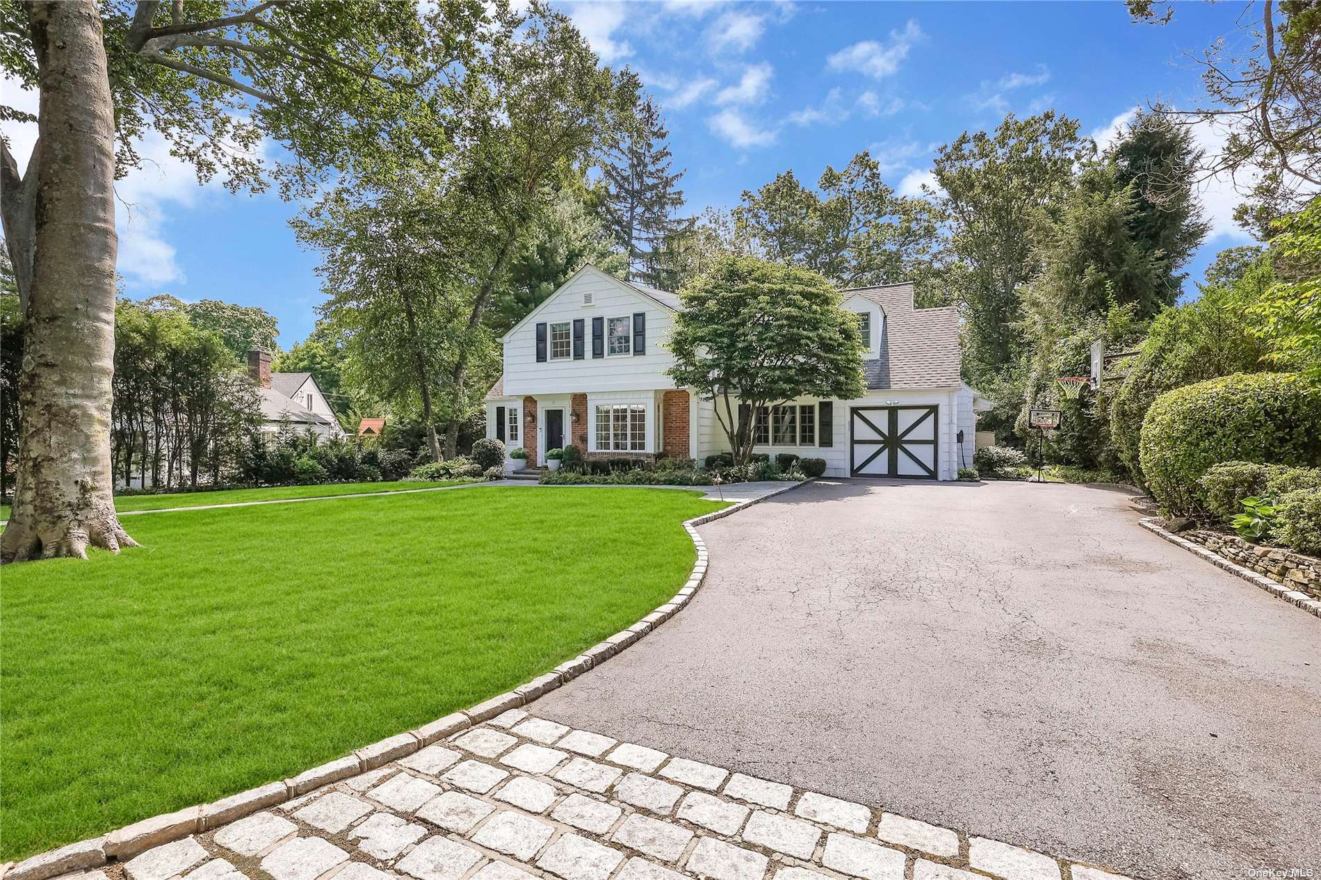 a view of a house with a yard and sitting area