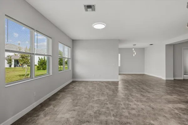 an empty room with a empty space and window