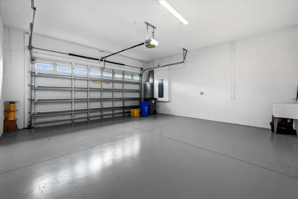 a large kitchen with a table and a large mirror in it
