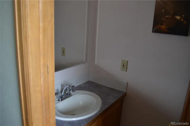 a bathroom with a sink and toilet