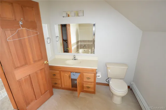 a bathroom with a toilet a sink and a bathtub