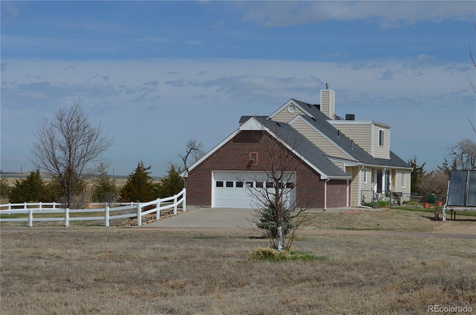 74500 East 136th Avenue Byers, CO 80103 - Photo 2 of 31 a front view of a house with a yard