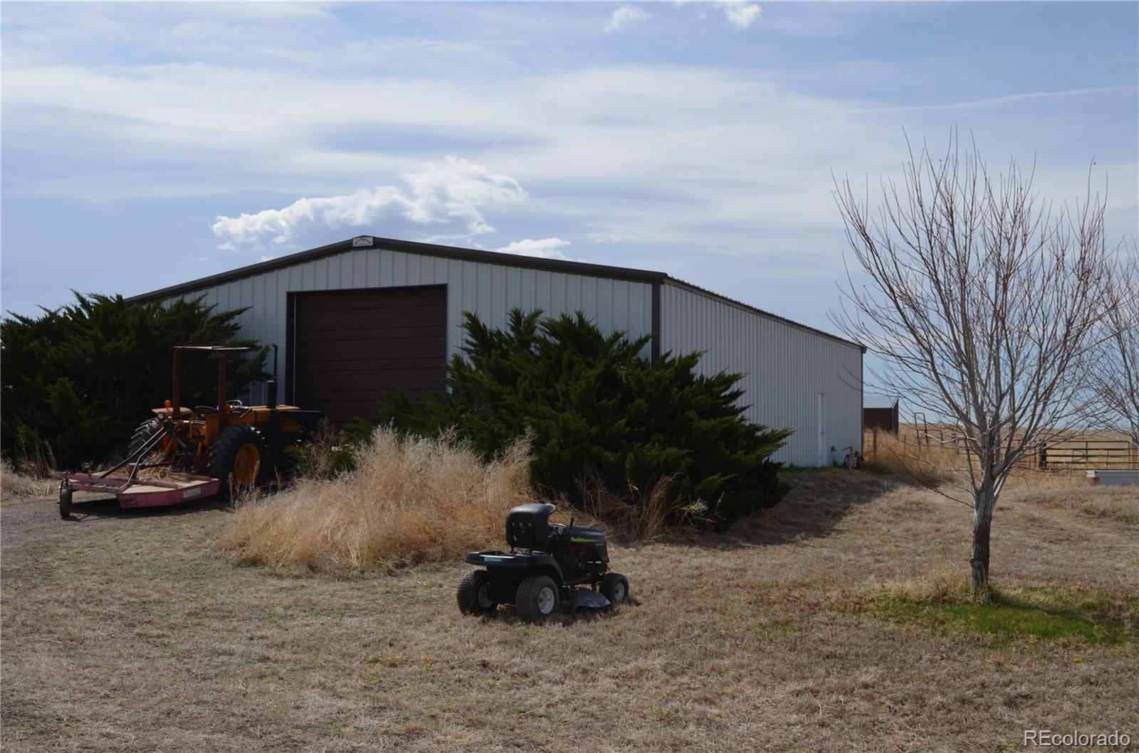 74500 East 136th Avenue Byers, CO 80103 - Photo 21 of 31 a front view of a house with garden