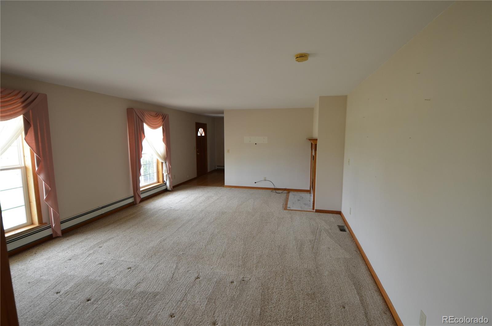74500 East 136th Avenue Byers, CO 80103 - Photo 4 of 31 a view of an empty room with a window